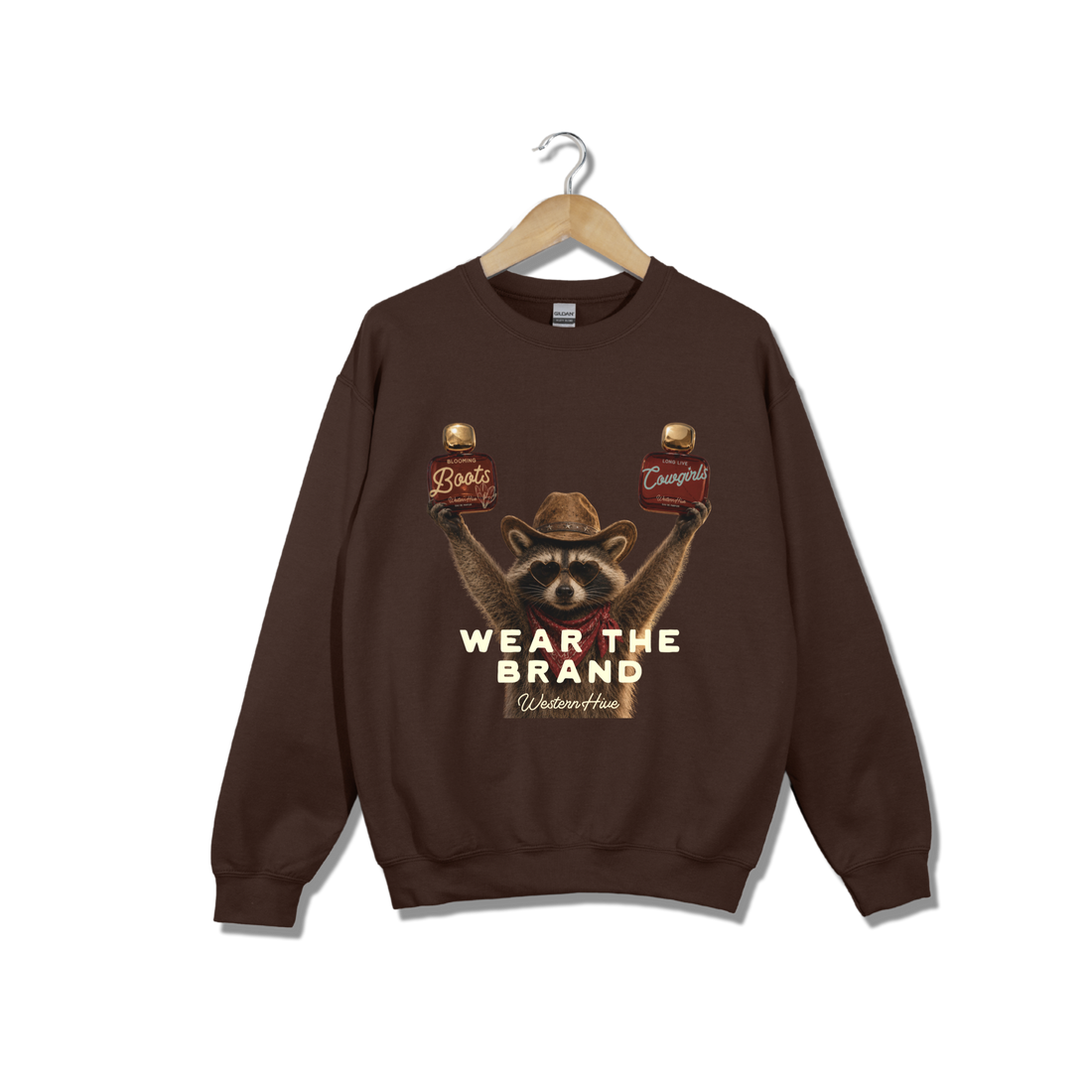 The sweatshirt features a graphic of a raccoon wearing a cowboy hat and holding two Western Hive perfumes &