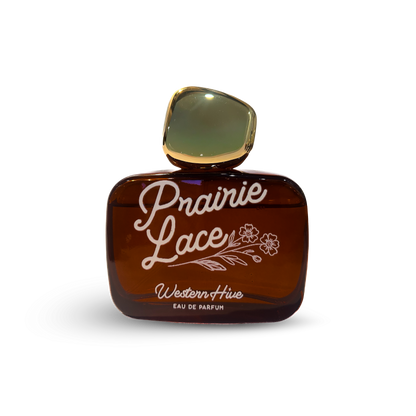 Prairie Lace 70ml cowgirl perfume by Western Hive featuring notes of green grass, vanilla cream, bergamot and wildflowers in an amber glass bottle